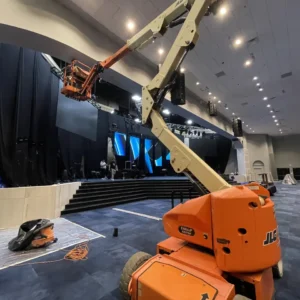 Detailed look at the stage area with rigging, framing, and equipment for the church's audio-visual systems.