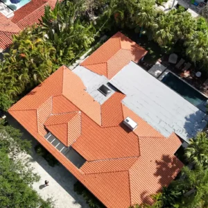 Panoramic drone shot showing the completed residential clay tile reroofing project for a luxury home in Coral Gables, FL.