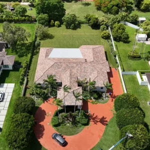 Shot of our professional roofing team performing preparation tasks on the roof of the Miami residence.